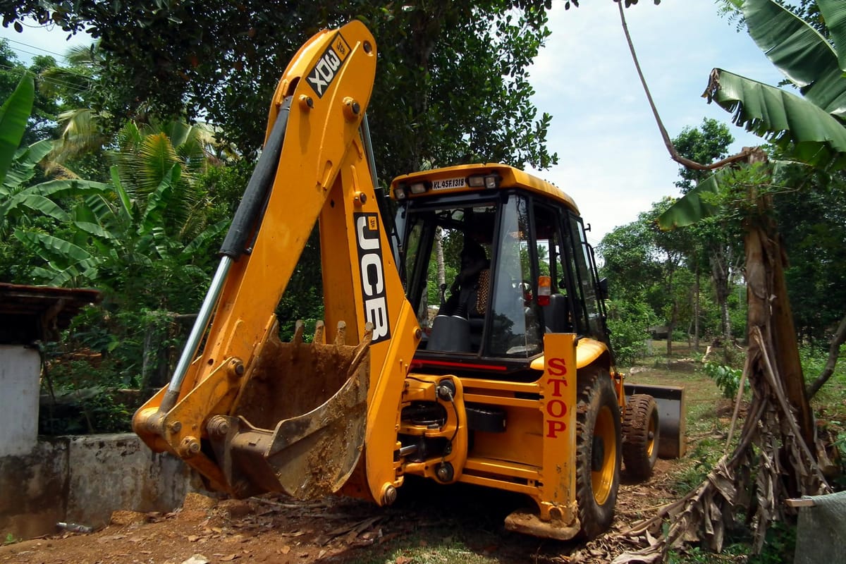 JCB backhoe loader working at an Indian construction site